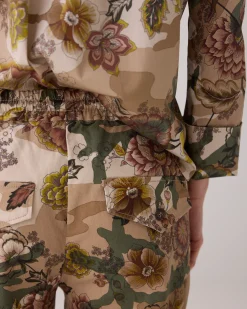 Trousers with camouflage and flower print