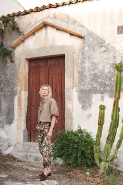 Trousers with camouflage and flower print