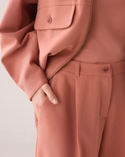 Trousers with pleated waistband